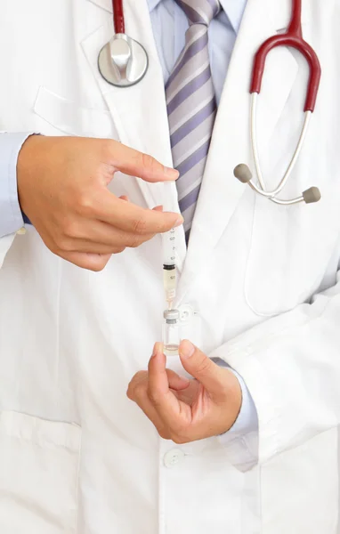 A doctor holding injector — Stock Photo, Image