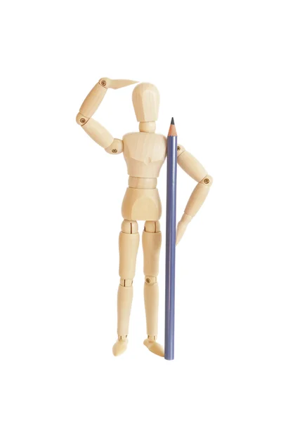 Figurine en bois mignon tenant crayon bleu et regardant — Photo