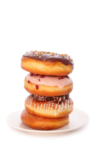 Ein Stapel Donuts auf weißem Hintergrund — Stockfoto