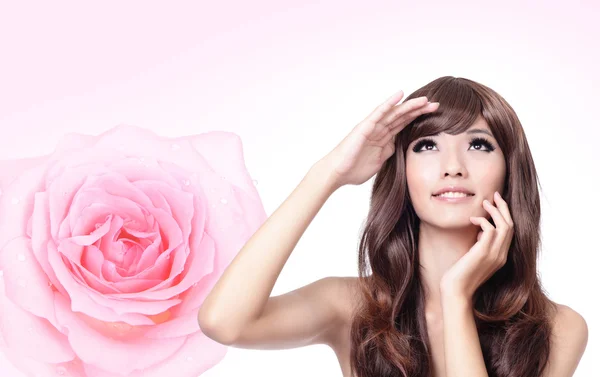 Girl look up forward with smile and pink rose — Stock Photo, Image