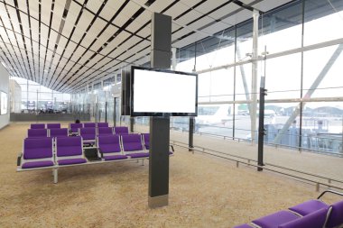 LCD TV and row of purple chair at airport clipart