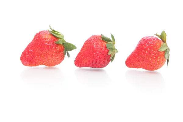 Three strawberries and reflection — Stock Photo, Image