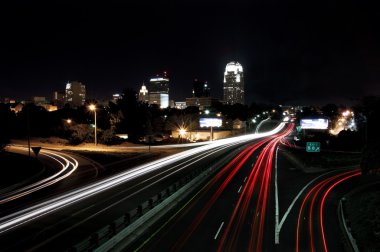 Downtown Skyline and Passing Cars clipart