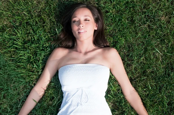 stock image Young Woman Laying in Grass