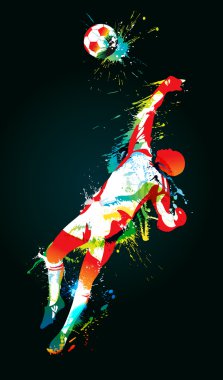 The football goalkeeper catches a ball on the black background