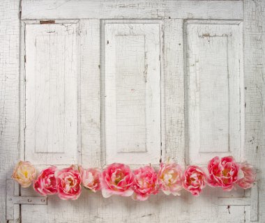 Flowers on a paneled vintage door clipart