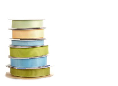 Spools of ribbon on white clipart