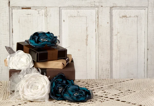 Wrapped vintage packages with flowers — Stock Photo, Image