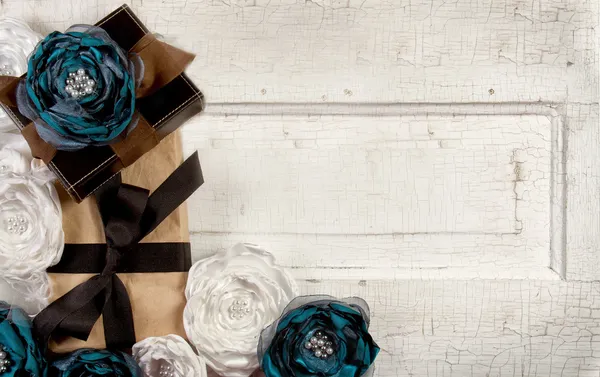 Wrapped vintage packages with flowers — Stock Photo, Image