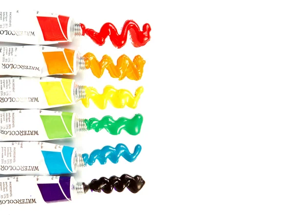 Tubes of watercolor paint on white background — Stock Photo, Image