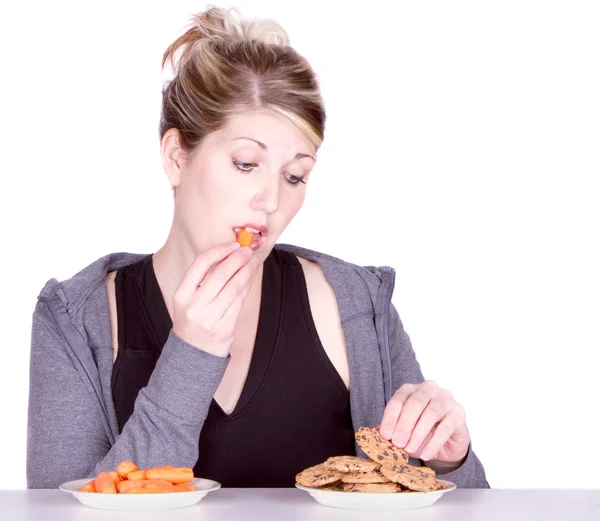 Woman on diet making eating choices — Stock Photo, Image
