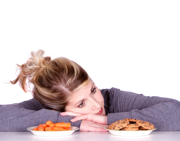Woman on diet making eating choices — Stock Photo, Image