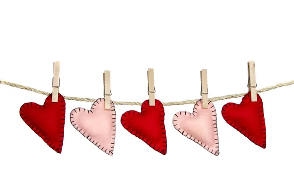 Stiched hearts on clothes line — Stock Photo, Image