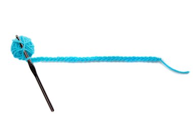 A blue ball of yarn with crochet needle clipart