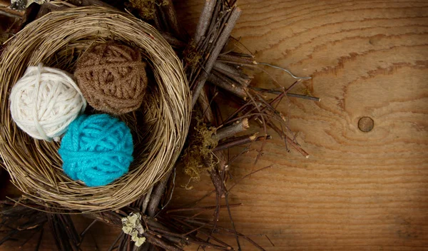 Balls of yarn in a nest — Stock Photo, Image