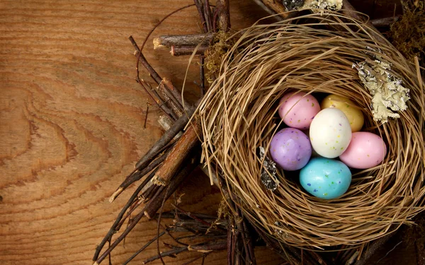 Easter candy in a nest — Stock Photo, Image