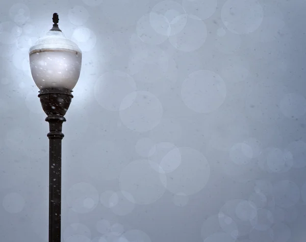 stock image A lamp post in a snow storm