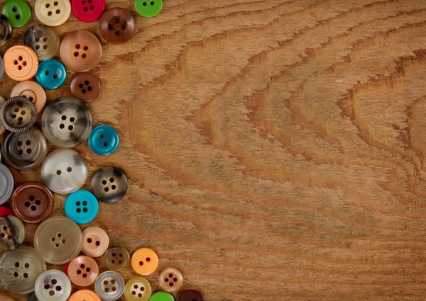 Buttons on a wooden background — Stock Photo, Image