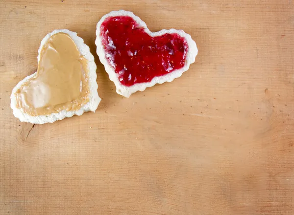 Peanut butter and jelly sandwitch cut in heart shape — Stock Photo, Image