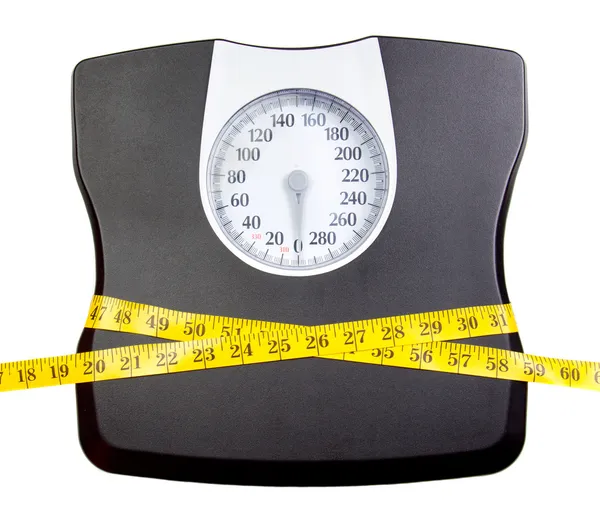 A bathroom scale with a measuring tape — Stock Photo, Image