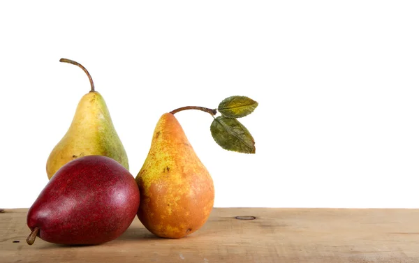 Three pears on a wooden plank — Stock Photo, Image