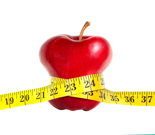 Une pomme maigre avec un ruban à mesurer — Photo