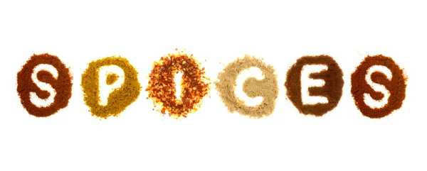 Assorted spices spelling the word spices — Stock Photo, Image