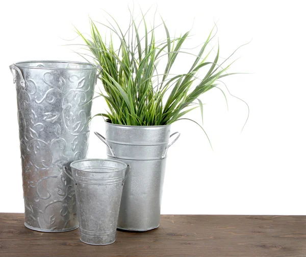 Metal gardening containers with grass — Stock Photo, Image