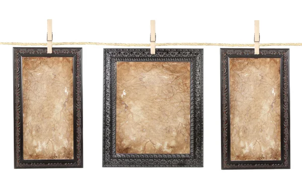 Three frames with aged paper on a line — Stock Photo, Image
