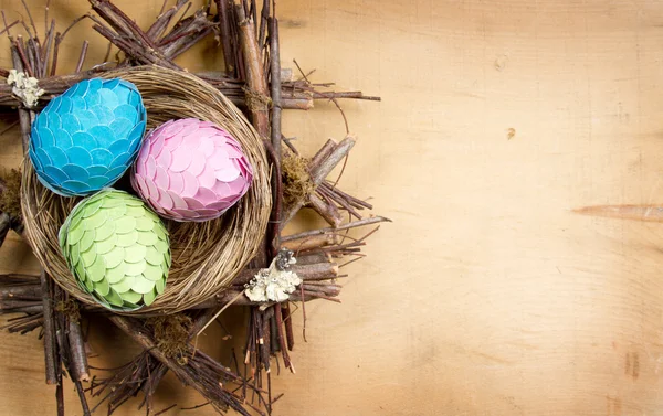 Handmade Easter eggs in a nest — Stock Photo, Image