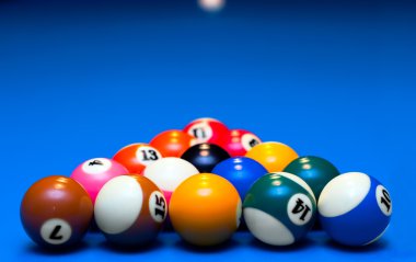 Pool balls triangle isolated on blue clipart