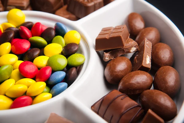 stock image Colorful chocolate sweets with random pieces of chocolate