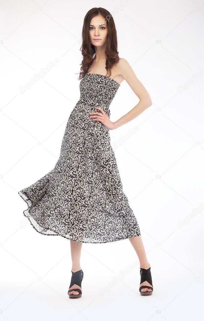 Fashion photo - lovely girl in grey dress on podium