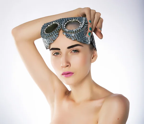 Pretty young naked woman fashion model in sport goggles — Stock Photo, Image