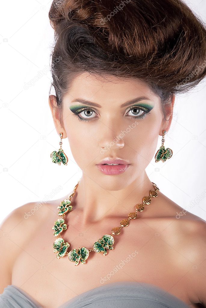 Luxurious hair model beautiful brunette with necklace closeup