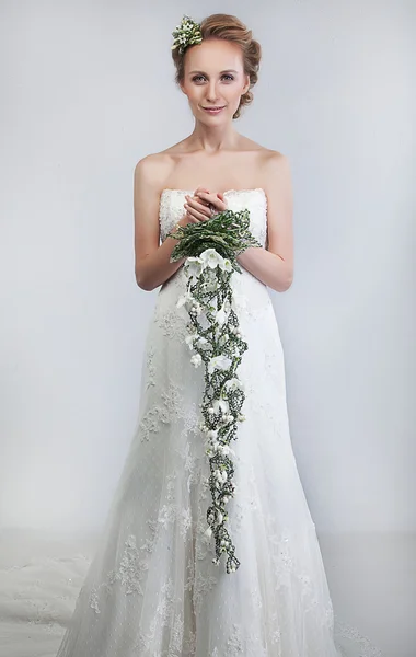 stock image Lovely bride blond with bouquet of fresh tender flowers