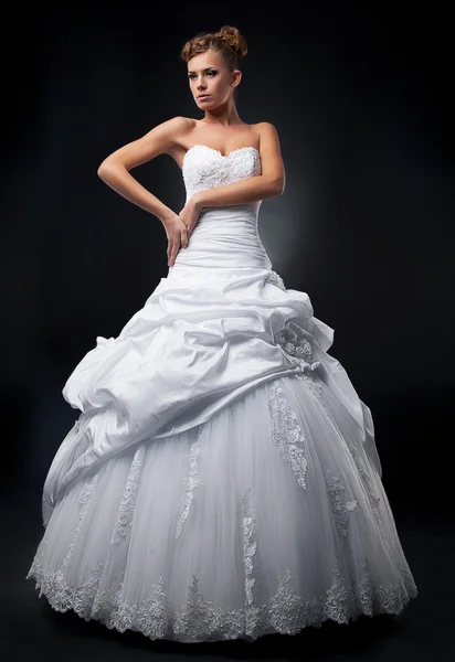 Luxurious fiancee super model shows white wedding dress — Stock Photo, Image