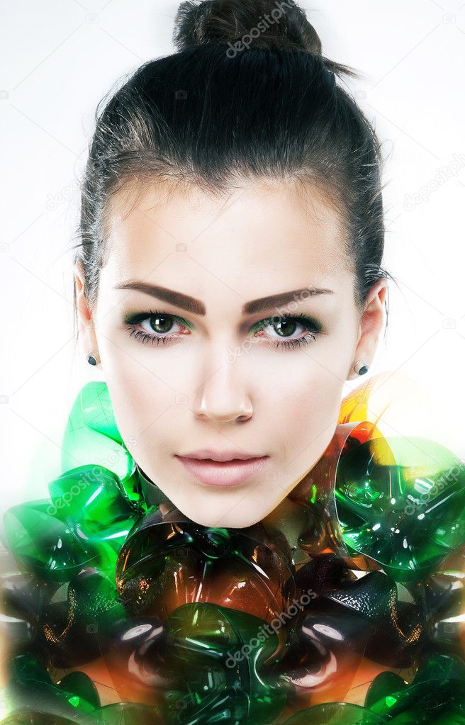 Art portrait of young attractive girl brunette close up