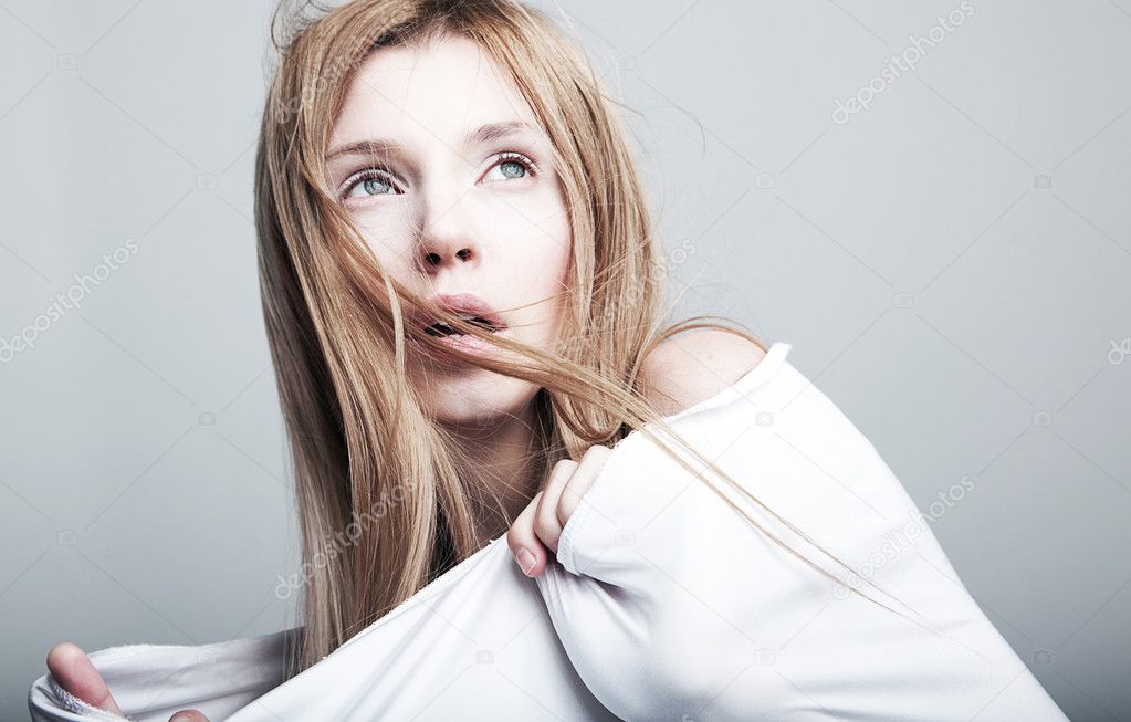 Nightmare - frightened lovely woman blonde in white clothes