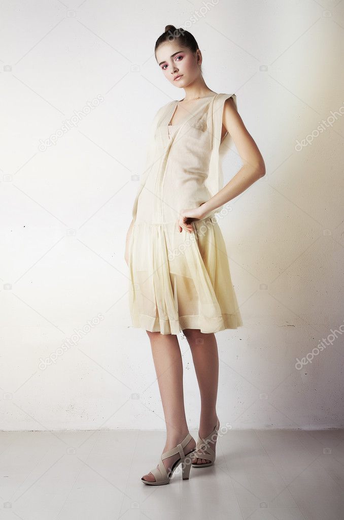 Beautiful girl in stylish fashion clothing standing