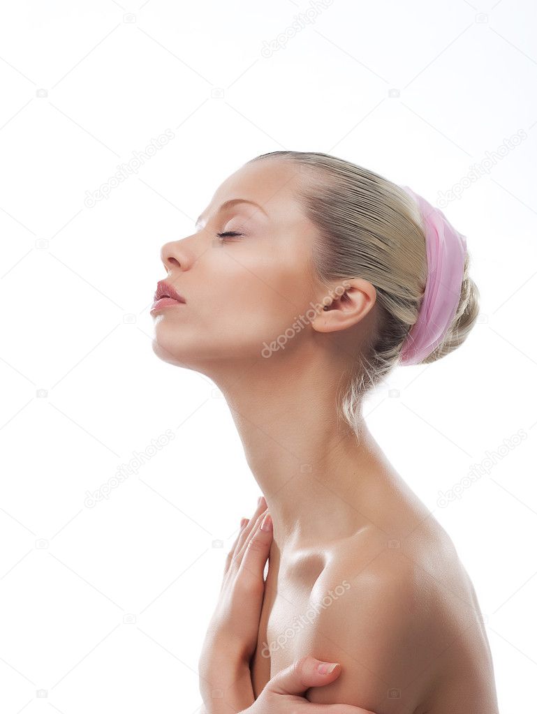 Attractive girl face with long neck. Skincare. Wellness