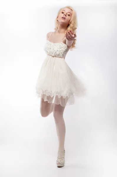 Emotions - running lovely girl blonde on white background — Stock Photo, Image