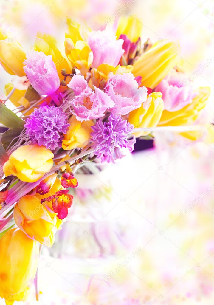 Vernal flowers bouquet over blurred background