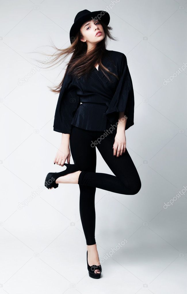 Beautiful young black fashion model in leggings Stock Photo by