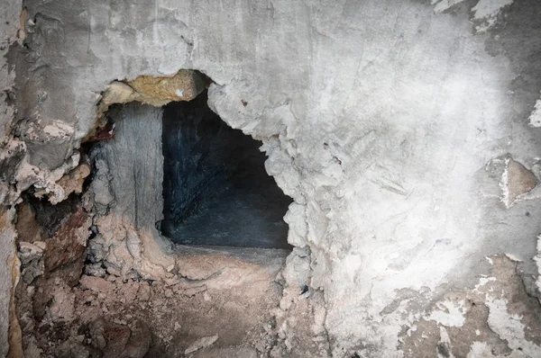 stock image Hole in stucco wall