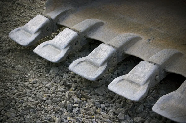 Teeths av spade av grävmaskin; industriella bakgrund — Stockfoto