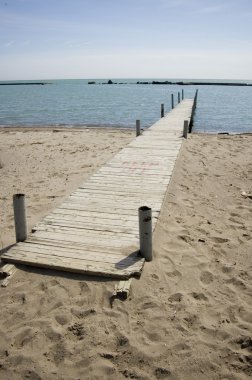 Pier; waterscape with horizon and blue sky clipart