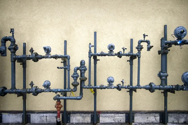 Cement wall , pipes — Stock Photo, Image