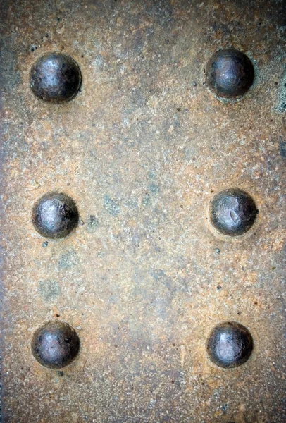 Bolts on rusty textured — Stock Photo, Image