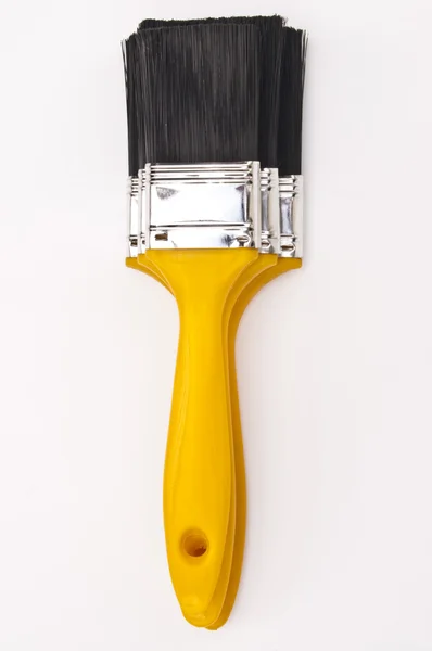 Drie gele verf penselen — Stockfoto